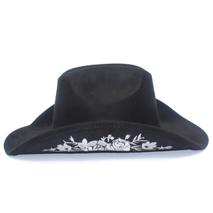 Close-up of premium black suede cowboy hat featuring intricate floral embroidery