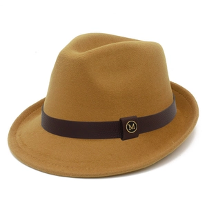 Detail of camel wool fedora hat with brown leather band and gold M metal buckle