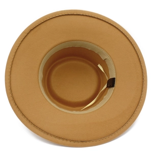 Detail of camel felt fedora hat interior with adjustable sweatband and fabric tag