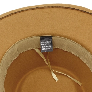 Macro detail of the interior sweatband and material care label on a brown fedora hat