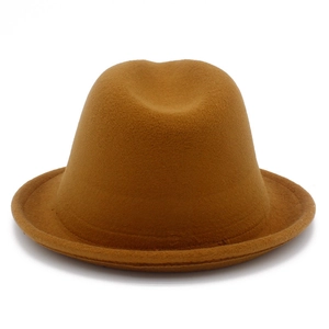 Close-up of the textured brown wool felt fedora with a classic pinched crown and short brim