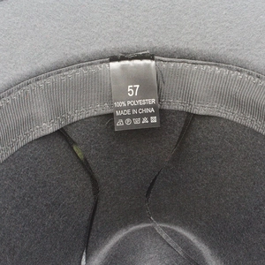 Interior detail of grey felt jazz hat with size 57 label and black sweatband