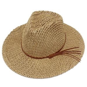 Detail of hand-woven straw fedora hat featuring a brown leather band and tassel accents