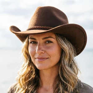 Close-up of deep brown wool felt cowboy hat featuring heart-shaped crown and woven band