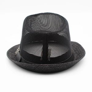 Detail of breathable mesh crown and woven straw brim on classic black jazz sun hat