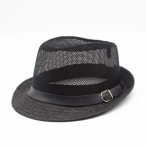 Close-up of black breathable mesh sun hat with leather band and gold buckle detail