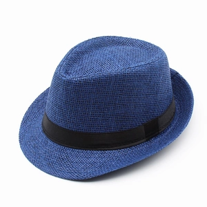 Detailed view of the dark blue woven texture and black ribbon band on a men's fedora hat