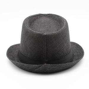 Detailed view of the dense woven texture and ribbon band on this dark gentleman sun hat