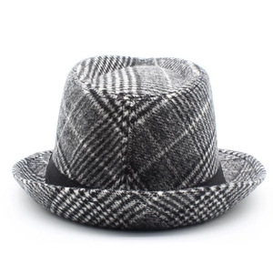 Detailed view of classic black and white checkered fedora hat with a black ribbon band