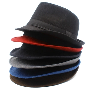 Vertical stack of wool felt fedora hats in six different colors on white background