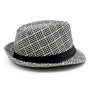 Close-up of black and white cross-weave texture and decorative band on straw fedora