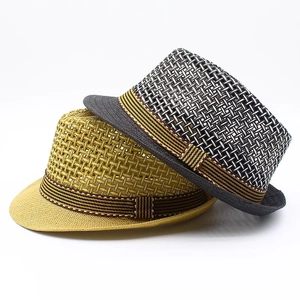 Detail view of woven mesh beach sun hats in yellow and grey with striped ribbon