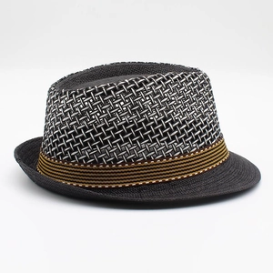 Detail of the grey breathable mesh knit pattern and decorative brown band on the sun hat