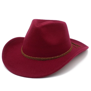 Detail of burgundy wool western cowboy hat with a dark brown braided leather band