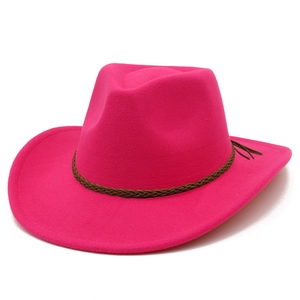 Close-up of fuchsia felt cowboy hat with a brown braided band and side tassel detail