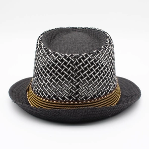 Close-up of mesh weave texture and striped band on a grey straw fedora hat