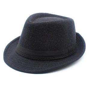 Close-up of the textured wool felt and ribbed decorative band on this classic fedora hat