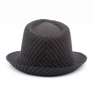 Close-up of classic black and white pinstripe pattern on a stiff gentleman fedora hat