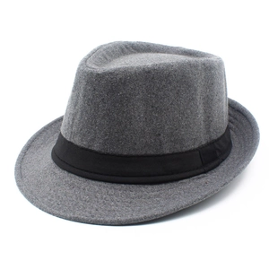 Detailed texture of dark grey wool fedora hat with a black ribbed ribbon band
