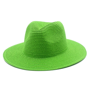 Neon green straw Panama hat for women featuring a wide brim and sun protection