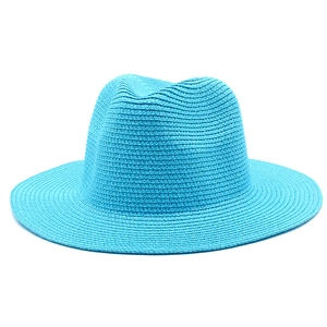 Close-up of vibrant blue woven straw panama hat featuring fine texture and classic fedora crown