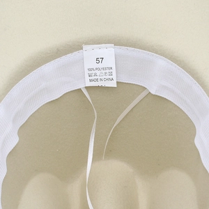 Detail view of adjustable inner band and wash label inside a 100% polyester fedora hat
