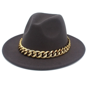 Close-up of dark grey wool fedora hat featuring a chunky decorative gold metal chain