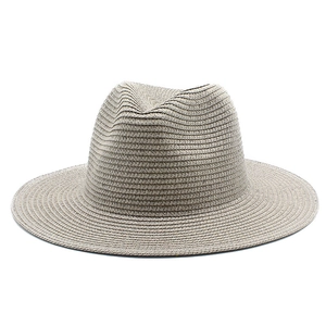 Detailed view of the fine woven straw texture on a beige Panama sun hat for women