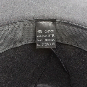 Detail view of cotton polyester tie-dye jazz hat interior with label and sweatband
