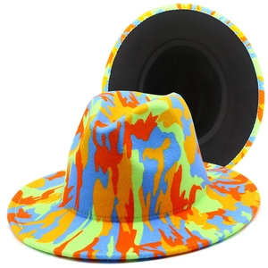 Detail of colorful abstract graffiti pattern and black lining on wide brim fedora hat