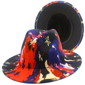 Detailed macro view of Fedora hat showing colorful abstract graffiti art with star motifs