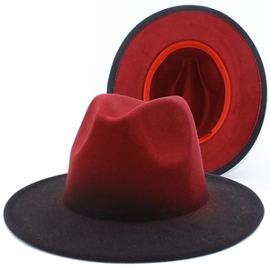 Detailed interior of red and black gradient fedora hat showing inner lining and sweatband