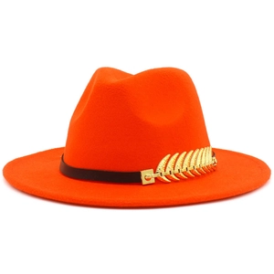 Detailed view of an orange fedora hat featuring a black band and gold feather metal accent