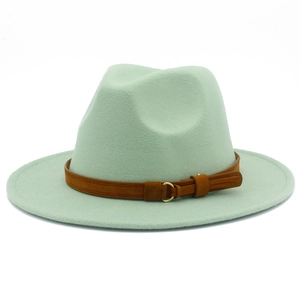 Detail of mint green fedora hat with brown suede band and golden buckle accent