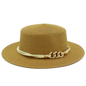 Detailed close-up of brown woven boater hat featuring beige rope and gold chain link accents