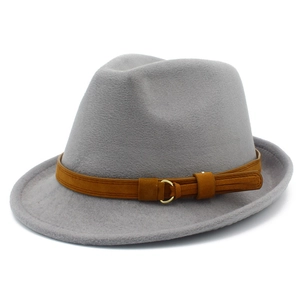 Detail of grey wool fedora hat featuring a brown faux suede band with gold metal buckle