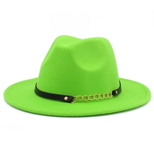 Detail of neon green fedora hat featuring black leather band and gold metal chain link