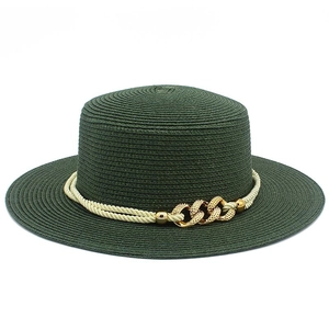 Detail of dark green boater straw hat with gold link chain and white twisted cord trim