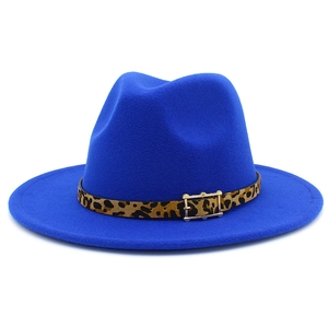 Close-up of electric blue wool fedora featuring a leopard print band and gold buckle detail