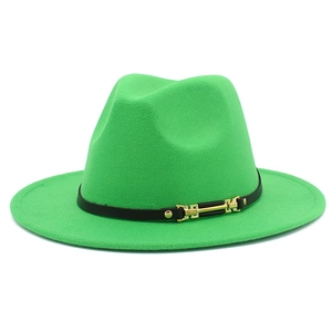 Detailed view of bright green wool fedora with black leather band and gold metal buckle