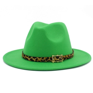 Macro shot of bright green fedora hat with leopard print band and golden buckle detail