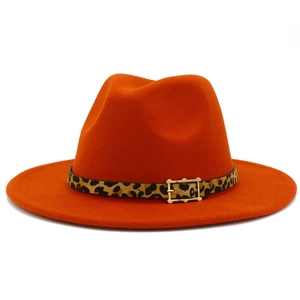 Close-up of orange wool felt fedora featuring a leopard print band and gold metal buckle