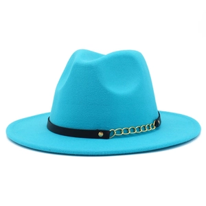 Detailed macro view of the turquoise felt fedora hat with gold chain and black leather band