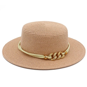 Detail of fine straw weaving with gold metal chain and rope band on sun hat