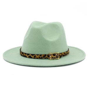 Detail of mint green wool fedora hat with leopard print belt and metal buckle