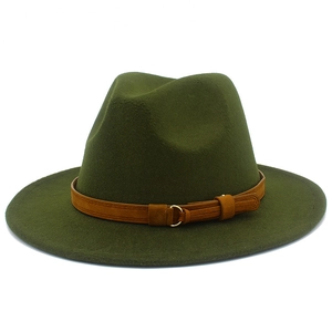 Detail of dark green wool fedora hat featuring brown faux suede band and gold metal ring
