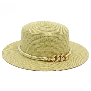 Straw sun hat with flat top and gold chain buckle detail for beach vacations