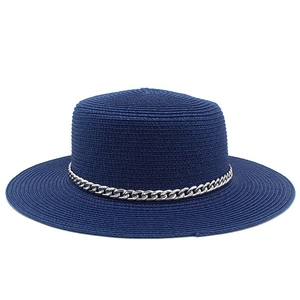 Navy blue boater straw hat featuring a wide brim and decorative silver metal chain detail