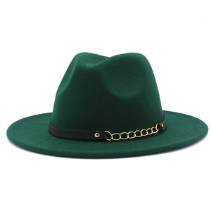 Detail of dark green wool fedora hat with black leather belt and gold chain trim