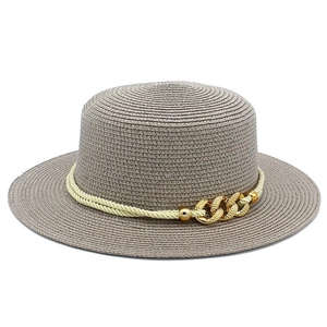 Detail of grey straw boater hat featuring yellow rope band and gold metal chain buckle